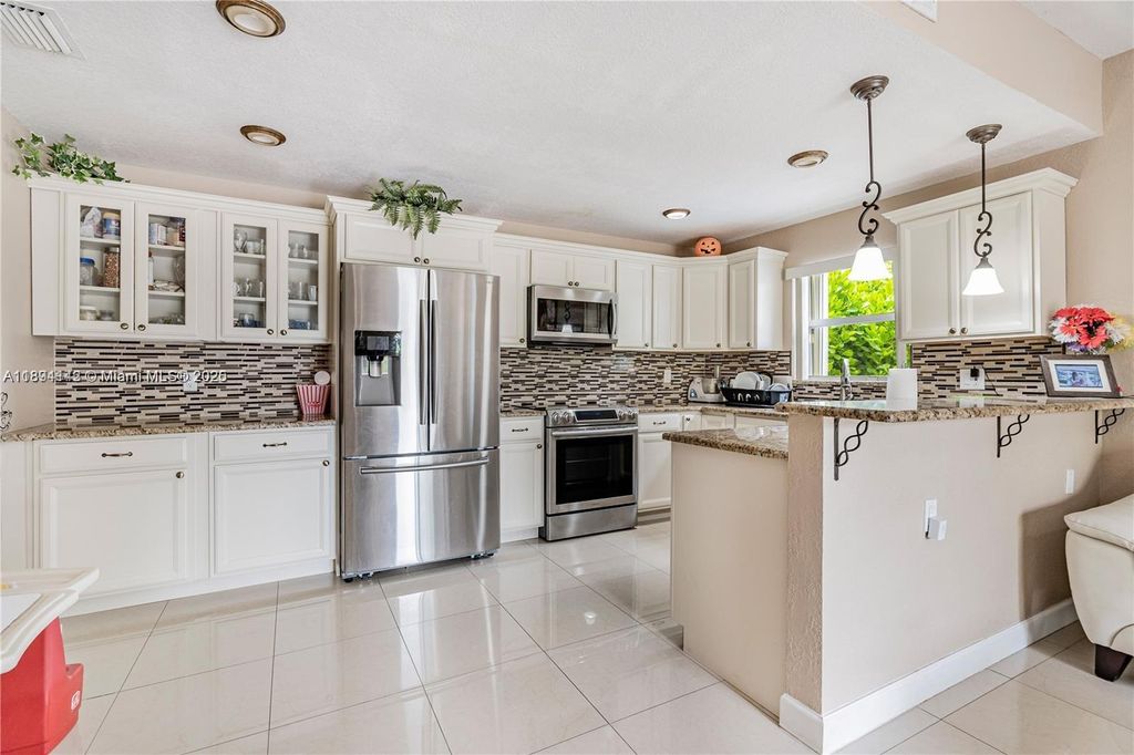Photo of 3412 NW 110th Way, Coral Springs, FL 33065 (MLS # A11894142)