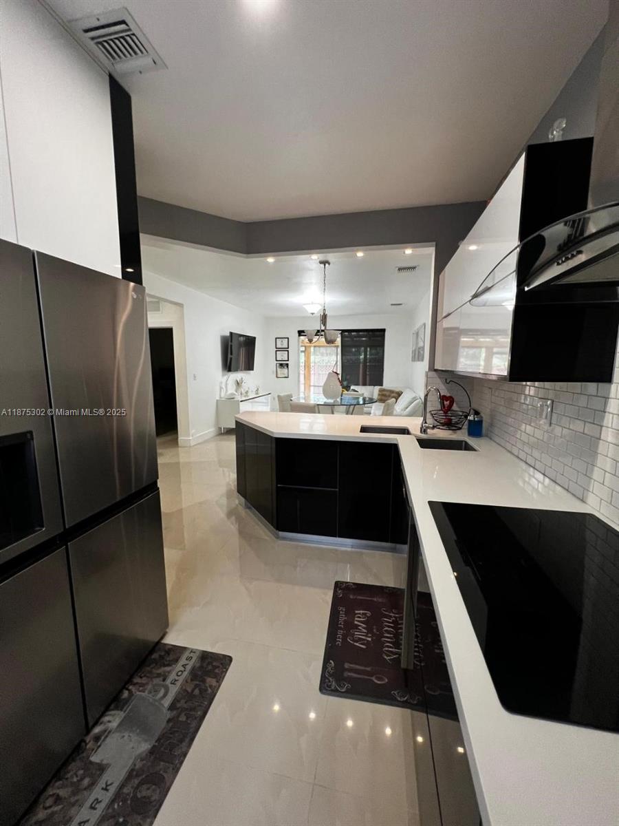 Tastefully remodeled 4/3 in the Casa Del Sur Development, closed to shopping, transportation and schools, Clubhouse, community pool.