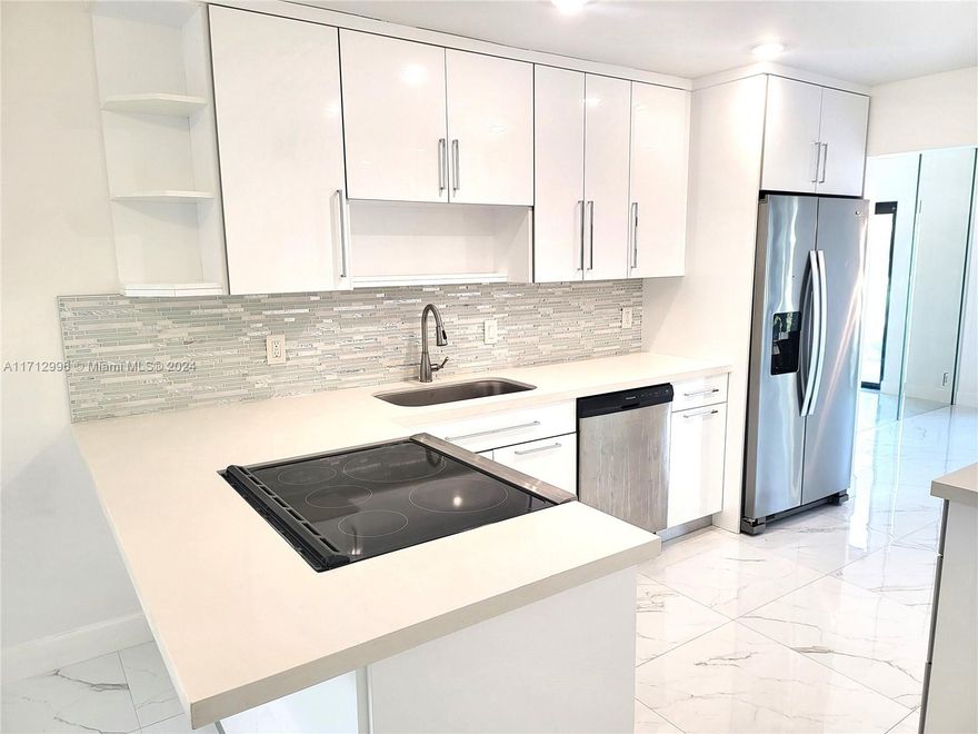 Don’t miss this opportunity to own this move-in-ready, fully upgraded home with electric blinds, impact windows & doors! Lots of natural light, this unit features an additional room on the lower-level ideal for a 4th bedroom or a home office. Enjoy cooking in the open-concept kitchen, entertain or unwind in the living or dining room with picturesque view of the water. Step onto the patio to enjoy serene waterfront views. Spacious primary suite includes a bonus area ideal for a nursery or cozy sitting area, a walk-in closet, & luxurious en-suite with dual sinks. Additional bedrooms are generously sized, ensuring comfort for everyone. With two assigned parking spaces conveniently located right in front, this home is ready for you to move in and make it your own. Schedule your viewing today!