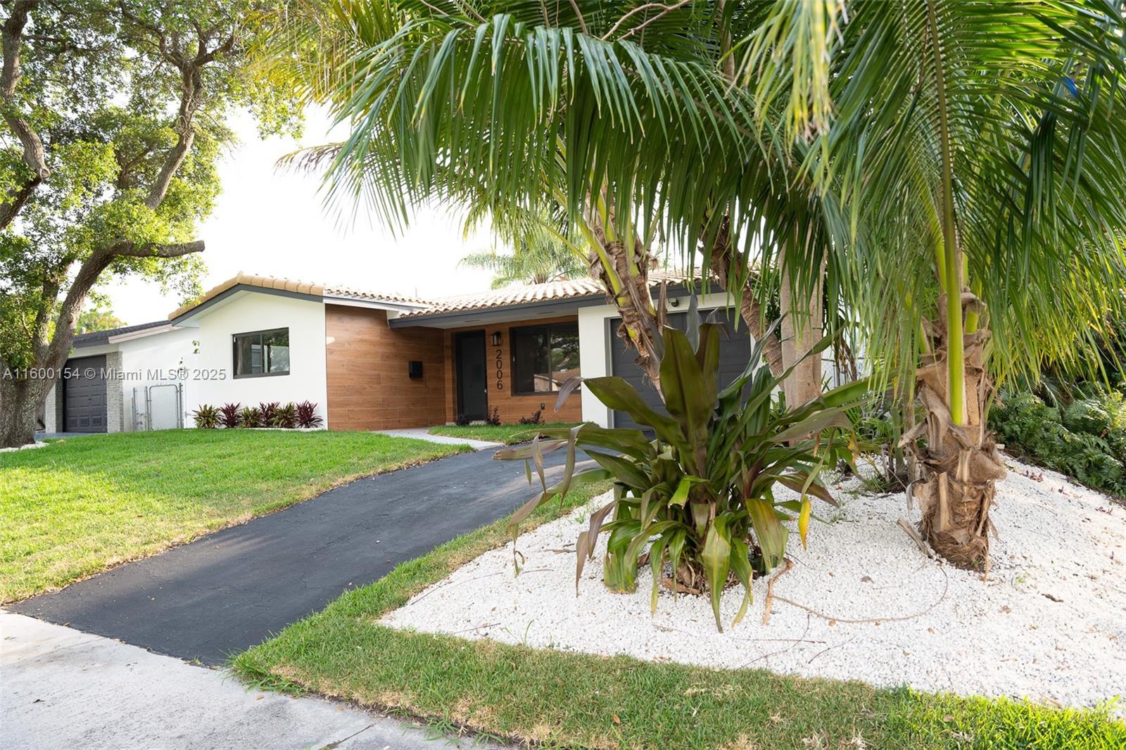 MODERN RENOVATED HOME IN HOLLYWOOD HILLS! DISCOVER THIS FULLY RENOVATED GEM! THIS MODERN 3 BEDROOM, 2 BATHS HOME WITH A ONE (1) CAR GARAGE BOASTS HURRICANE IMPACT WINDOWS & DOORS & TILE ROOF. STEP INSIDE TO FIND A MODERN WHITE KITCHEN WITH CORIAN COUNTER TOPS & STAINLESS STEEL APPLIANCES, COMPLEMENTED BY MODERN BATHROOMS DESIGNED FOR LUXURY & COMFORT. THE HOME FEAUTURES ELEGANT 24x48 PROCELIAN TILE FLOORING THROUGHOUT, ENHANCING ITS STYLISH APPEAL. ENJOY AN OPEN & SPACIOUS LARGE PATIO, PERFECT FOR ENTERTAINING OR RELAXING. THE PROPERTY SITS ON A CORNER LOT WITH A FENCED TROPICAL YARD PROVIDING PRIVACY & AMPLE SPACE FOR OUTDOOR ACTIVITIES. ADDITIONALLY LOCATED JUST STEPS FROM TOP RATED SCHOOLS & HOUSE OF WORSHIP. MINS. TO BEACHES, PARK, AIRPORT, I-95, HOSPITALS, MALLS & DANIA POINTE.