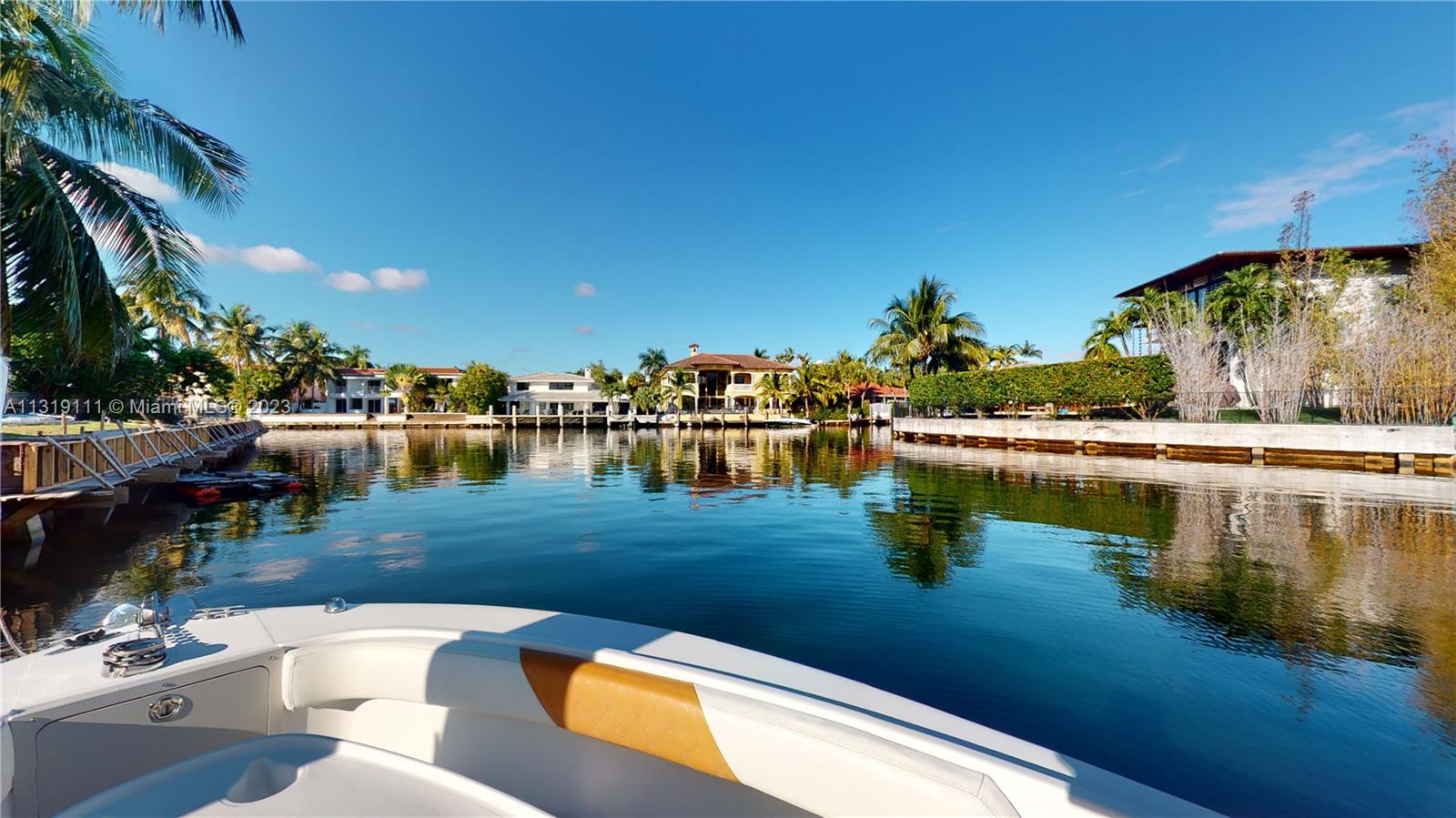 Spectacular one-story waterfront property located in the heart of Eastern Shores. This beautiful home has 4 bedrooms and 3.5 bathrooms, Italian gourmet kitchen with stainless steel appliances, open floor plan with spacious living and dining rooms, high impact windows, two car garage, laundry room, marble and wood floors throughout. Master bedroom suite comes with two walk-in closets and private bathroom with dual vanity, separate bathtub, and shower. One of the bedrooms with a full bathroom is located in the pool area. Backyard has a pool/jacuzzi, private 80ft dock for boat/jet skis in a canal with direct ocean access. Just minutes away from the beach, Aventura, Bal Harbor shops and restaurants. Call listing agent to show.