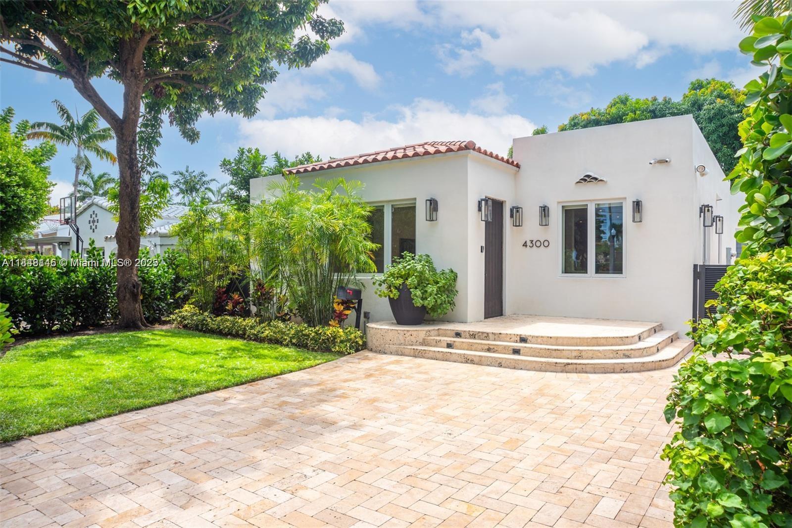 Fully furnished, a few blocks from the BEST beaches, immaculate & in ready for move in condition. Just bring your toothbrush. Custom designed home located in the heart of Miami Beach. Open concept layout w/chic sun drenched interiors. Boasting area w/high 15ft vaulted cathedral ceilings, den w/built-in storage space, DeChateau White Oak wood floors, Somify motorized shades, & beautiful new open Chef's gas kitchen w/island, custom millwork, wine fridge & high-end Thermador appliances. Offering a primary suite w/huge walk-in closet & bath w/rain shower & dual sink. The private, fenced backyard has lush landscaping, a towering mango tree, fire-pit, & a 150SF A/C storage shed. Complete w/freshly painted interiors, impact windows & doors, security system. Home as new A/C & tankless water heater