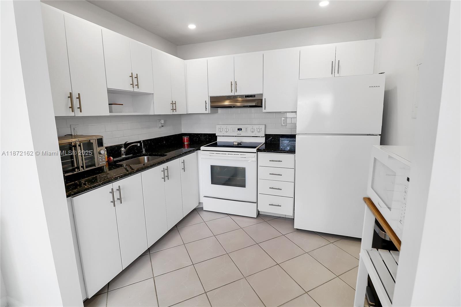 This charming one-bedroom condo is located on the second floor, offering both privacy and elevated views. As a desirable corner unit, it’s filled with natural light. Inside, bright white kitchen featuring granite countertops, newer appliances, and updated lighting—no outdated dome lights! The home also includes a full laundry and utility room with washer & dryer adding comfort and convenience. The versatile north-facing back porch expands your living space year-round. Whether you use it as a sunroom, sewing room, workout area, extra storage, or a cozy reading nook, the possibilities are endless. Enjoy west-facing sunset colors from your windows, and take advantage of all that Kings Point has to offer—a guard-gated community with endless amenities. This home is move-in ready, easy to show!