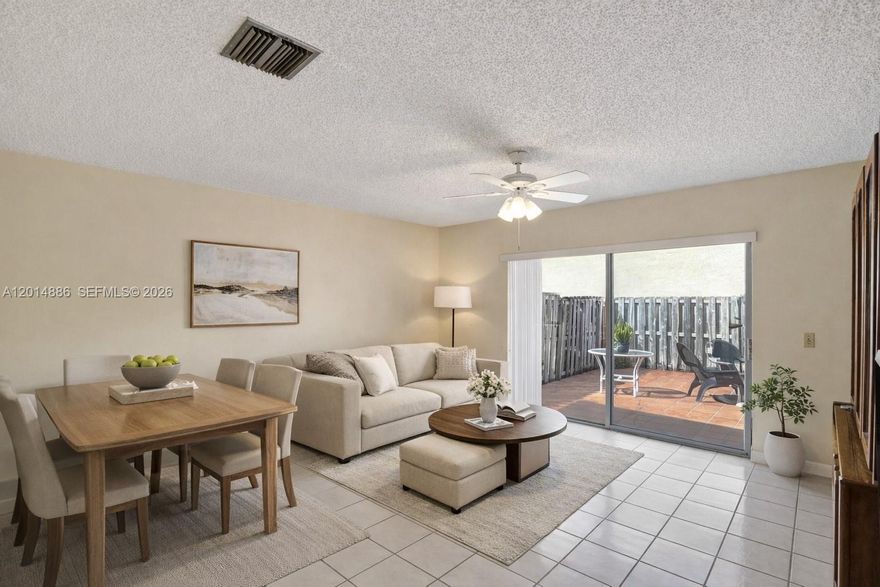 Spacious two-story home nestled in the heart of Charlestowne, a peaceful gated community in Miami. This 3-bedroom, 2.5-bath residence offers over 2,000+ square feet of flexible living space, a 2-car garage, and parking for up to four vehicles, ideal for growing families or those who love to entertain. Step inside to find a thoughtfully renovated kitchen featuring granite countertops and elegant maplewood cabinets that blend style with function. Recent upgrades include a new water heater and AC system, ensuring comfort and efficiency for years to come. Accordion hurricane shutters throughout provide year-round storm protection and peace of mind. The real gem? A generous fenced patio with endless possibilities. Envision your dream outdoor oasis, summer barbecues, or even a sparkling pool to call your own. This home is being sold as is and offers tremendous potential for personalization and value creation. With low HOA fees and access to a clubhouse, resort-style pool, tennis and basketball courts, and a children's playground, Charlestowne delivers the South Florida lifestyle families cherish. Zoned for top-rated schools, this location offers both convenience and quality education. Bring your vision and your offers!