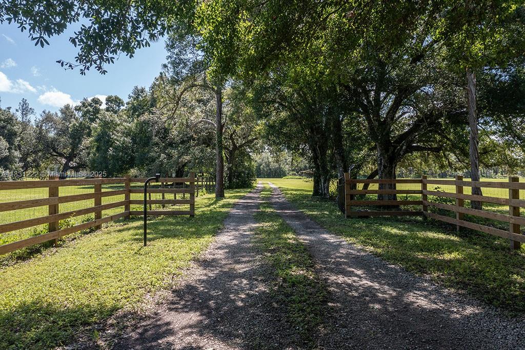 "HIDDEN ACRES RANCH" A BUCKINGHAM GEM! LOCATED "OFF THE ROAD WELL-TRAVELED" AND ON A TRANQUIL OAK-CANOPIED PRIVATE ROAD IN THE HEART OF BUCKINGHAM. Fall in love with this square-shaped 10 acres of scenic pasture with its's multi-level home, and upscale pole barn boasting air-conditioned office and outdoor kitchen. Old-fashioned farmhouse style home has 3 levels including 2 separate garages with a center laundry room on level 1 with level 2 featuring the living room, dining are and country kitchen, front entry, guest bedrooms, and full bath. Level 3 features a family/theater room and primary bedroom suite. Home is frame with a 2009 metal galvalume roof-over, spray-in foam insulation, and 2015 air conditioning system including duct work. Home will require some TLC.