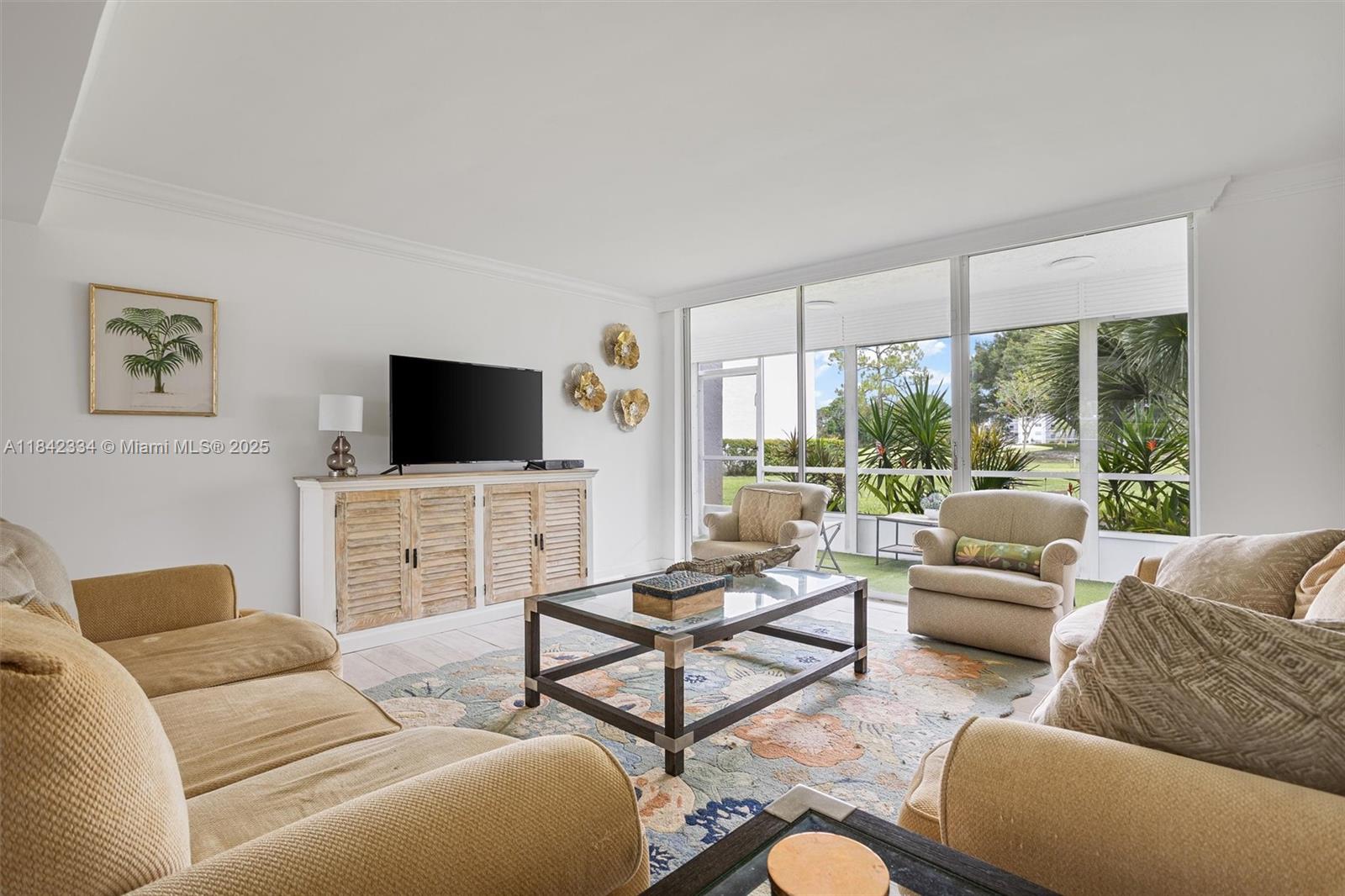 Fully remodeled 3BD/2BA first-floor corner unit in Dorchester at Poinciana, a vibrant 55+ community. Enjoy a modern kitchen with quartz countertops, 42" wood cabinets, and bar seating. Porcelain tile flows throughout the unit. The primary suite includes a walk-in closet and glass shower. Relax in the bright, screened patio overlooking the golf course and pool. New 2023 roof, elevators, and fully funded reserves. HOA includes water, cable, Wi-Fi, golf, tennis, gym, clubhouse, and more. Just 20 mins from the beach!