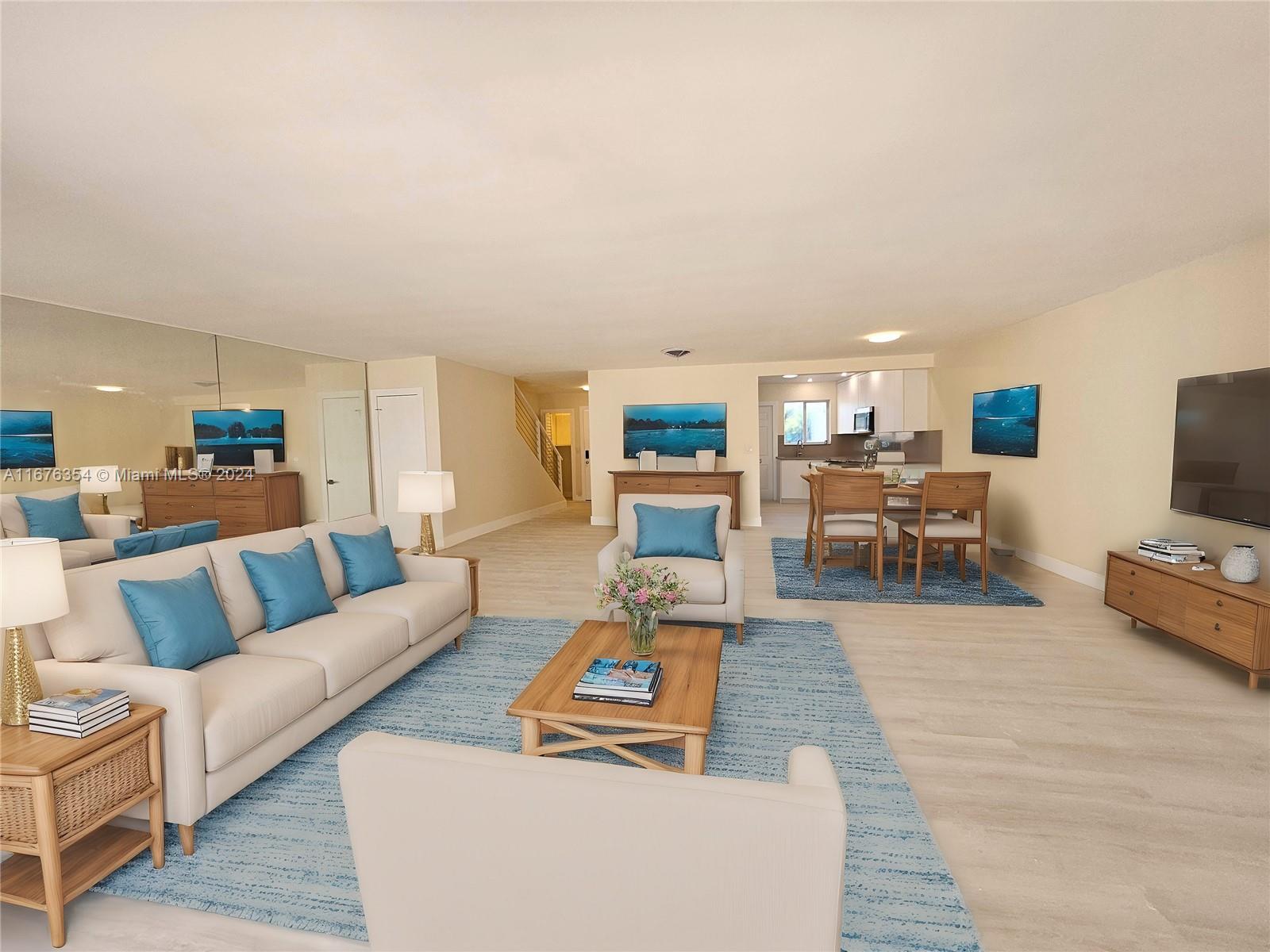 spacious totally renovated townhouse featuring vinyl floors, stainless steel appliances, new kitchen cabinets and closets, upgraded bathrooms with a peaceful view of the canal, close to schools and shopping areas and only a few blocks from the ocean. carport in the driveway can fit up to 2 cars.