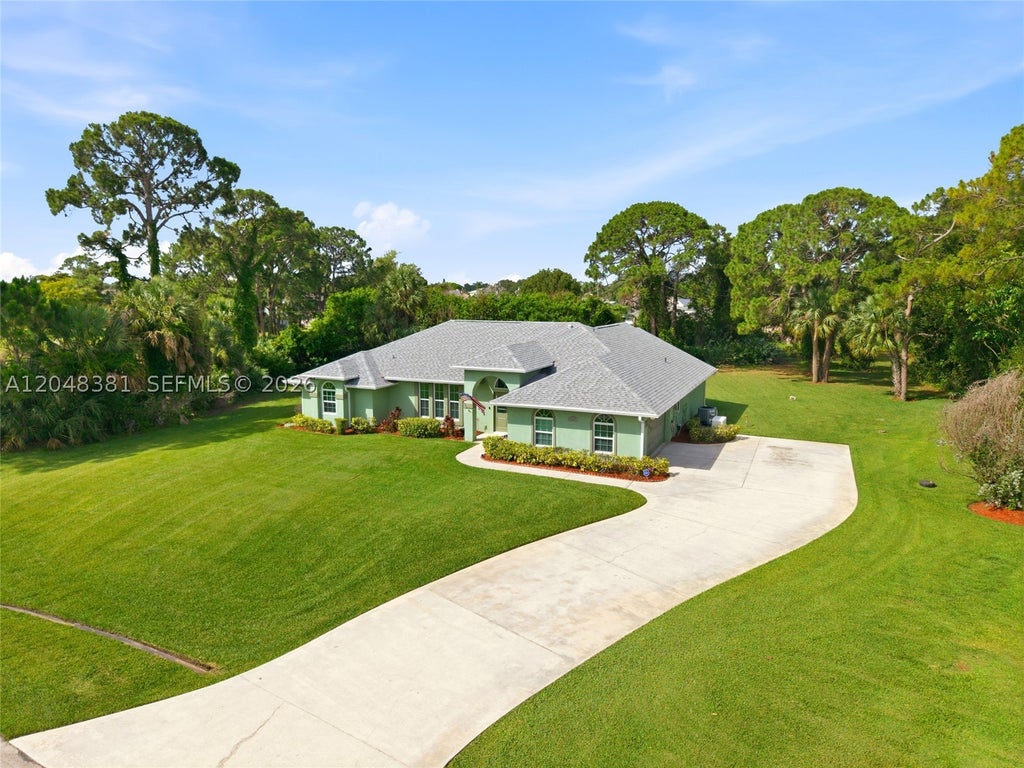 Photo of 2472 SE Hillard Rd, Port St Lucie, FL 34952 (MLS # A12048381)