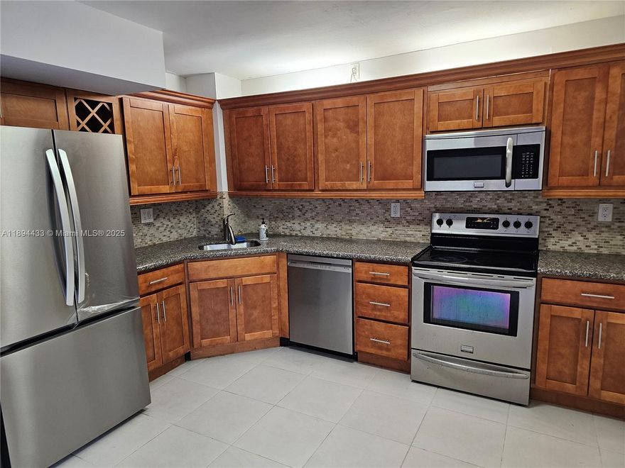 Substantially remodeled 3 Bedroom 2 1/2 bath unit.  Cathedral ceiling in Master.  Extra space loft in the master bedroom.  Unit backs up to trees (a single family house backyard.)  Back patio is screened with a wood deck (both of which will be repaired before closing).   Great neighbors...great community.  Walking distance to Whole Foods, Target and Busway.  New double electric range ordered but not delivered yet.  Newish refrigerator, dishwasher, bath vanities.  AC is high efficiency couple of years old. Easy to show.