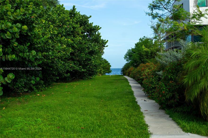 Captivating walled & gated villa on coveted Saint Gaudens Rd. Just steps to Biscayne Bay and a short walk to the Grove village center’s many galleries, boutiques & cafes. Light-filled living spaces feature volume ceilings, beautiful porcelain and wood flooring & lovely views throughout of the lush landscaping that surrounds the home.Totally restored & updated, including a stunning kitchen w/French antique cabinetry, Calacatta Gold counters, walk-in pantry & Sub-zero/Thermador appliances. Spacious primary suite offers a room sized walk-in closet & luxurious marble bath w/frameless glass rain shower. 4BR/3.5BA+1BR/1BA attached guest quarters. Not a flood zone. Experience tranquility on shaded outdoor terraces overlooking the heated salt-water pool & a magical, ultra-private tropical garden.