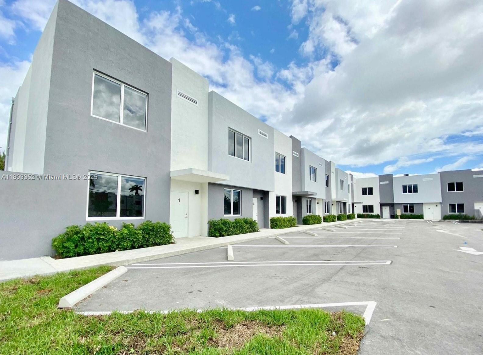 Elegant new construction townhome in Miami, centrally located near the Golden Glades interchange. This residence offers a bright, open floor plan perfect for entertaining, with a modern kitchen flowing seamlessly onto your private patio and yard. Kitchen boasts granite counters and stainless steel appliances. Features include hurricane impact windows, private in-unit washer/dryer, and one ground-level bedroom. Convenient to Tri-Rail and major expressway access. Nearby: Biscayne Gardens, Brandon Park, North Miami, Golden Glades transit hub & shopping corridors.
