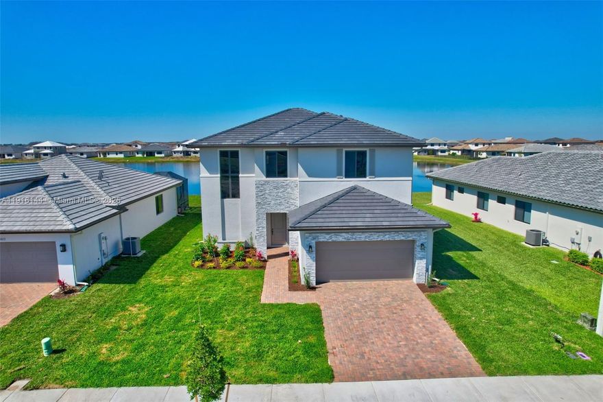 This never-lived-in 2025 Captiva Garden Collection Hanford model offers tranquil lakefront living in Maple Ridge at Ave Maria—about 1 hour from Weston and Broward communities. Featuring 4 bedrooms, 3 bathrooms, a spacious loft, and 3,390 sq ft under A/C, this contemporary home includes CBS construction, impact glass, tile floors, and upgraded finishes. The chef’s kitchen has quartz countertops, upgraded cabinetry, and Whirlpool stainless steel appliances. A first-floor bedroom with full bath is ideal for guests or multigenerational living. No construction wait—move in and enjoy the clubhouse, pool, gym, parks, and more.