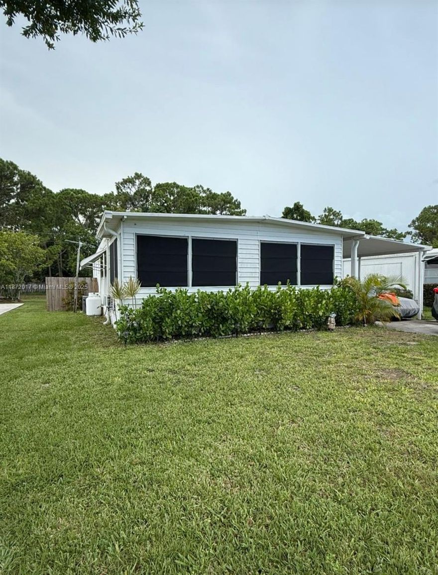 **You Own the Land—No Lot Rent** The fully fenced yard is large enough to accommodate a small boat. Located within a quiet community for all ages. While the home needs some cosmetic updates, it’s a great investment or a blank canvas to make your own. It features a generous family room, 2 bedrooms with possibility of adding a 3rd one, 1.5 bathrooms, an enclosed Florida room, utility room with washer & dryer & a large storage shed. A large rear deck gives extra space for entertainment.

The home features recently updated kitchen, cabinetry, sleek countertops & stainless-steel appliances. 

AC was replaced ~3 years ago & the metal roof has been regularly maintained. Minutes to major highways, Indian River State College, hospital, park, boat ramps, shops & restaurants.