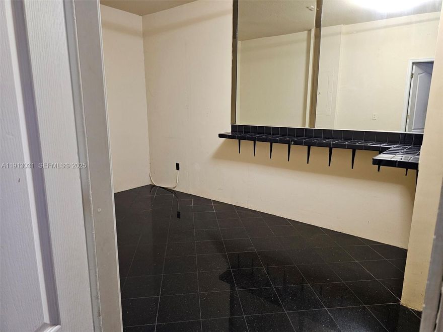 Spacious 4-bedroom, 3-bathroom townhouse featuring 1 bedroom and a full bathroom on the first floor; the primary bedroom includes a jacuzzi, along with 2 large secondary bedrooms on the upper level. Easy to maintain with updated waterproof flooring throughout. Modern kitchen with granite countertops, washer and dryer, 1-car garage plus space for 2 additional vehicles (parking allowed in the driveway only, not on the grass). Amenities include a clubhouse, swimming pool, and playground. Excellent location near the Turnpike, in a park-like setting with a walking trail. Community pool and gym in Majorca II, west on 13th Ct to the first left.