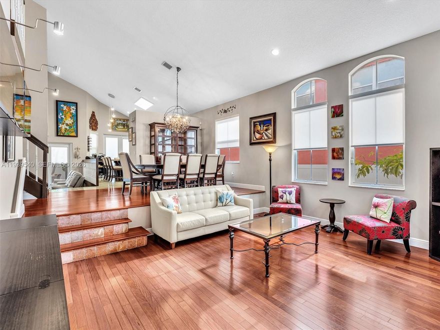 Beautiful four-bedroom, three-bath home located in the desirable Riviera Isles community, offering a resort-style clubhouse and amenities. The residence features a custom kitchen with upgraded cabinetry, butcher block island, quartz countertops, double oven, and KitchenAid appliances. Hardwood flooring enhances the main living areas, while bamboo flooring and blackout shades are featured in all bedrooms. The fully updated primary bathroom adds a modern touch. Enjoy integrated indoor and outdoor speaker systems and an insulated pergola with travertine flooring. A move-in-ready home designed for both comfort and entertaining.