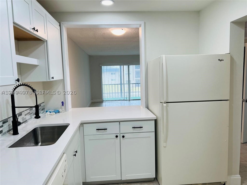 Photo of 8025 S Colony Cir S #210, Tamarac, FL 33321 (MLS # A12094076)
