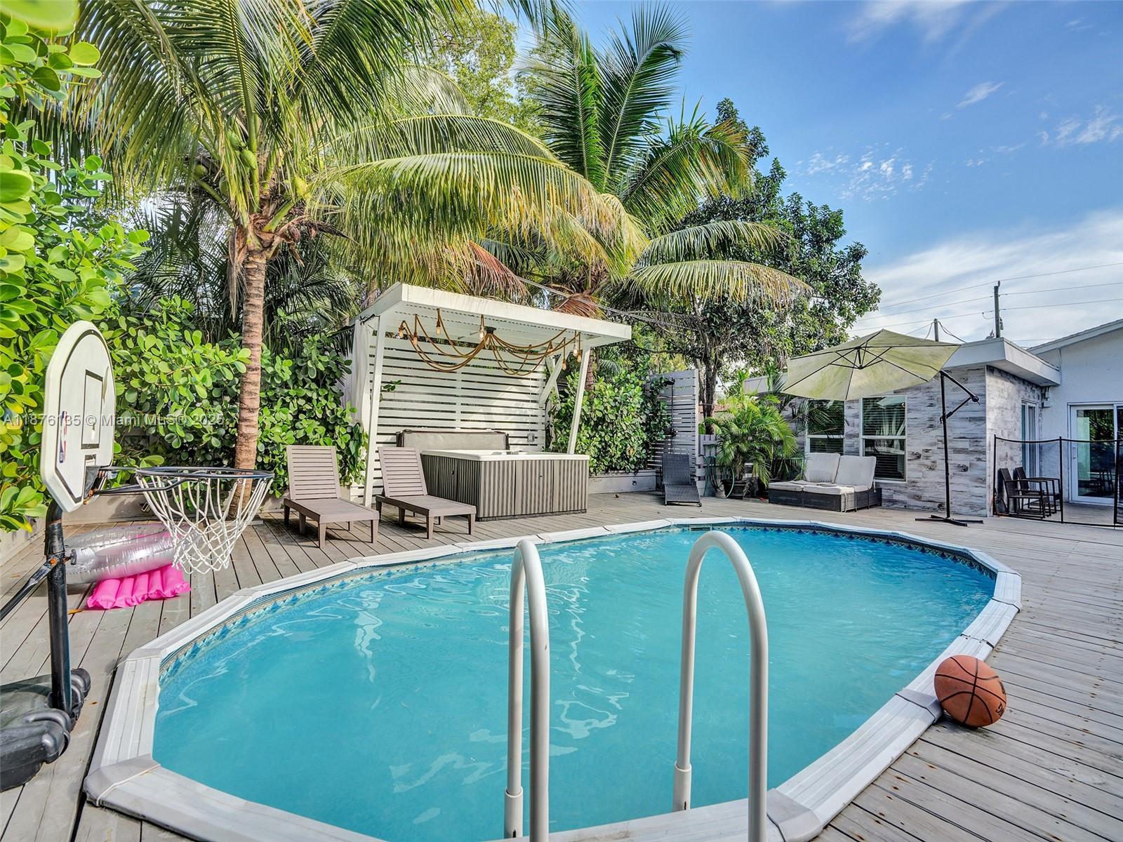 INTRODUCING A BEAUITFULL 4 BEDROOM 2 BATH IN THE HEART OF DANIA BEACH FULLY FURNISHED A MUST SEE COZY HOME