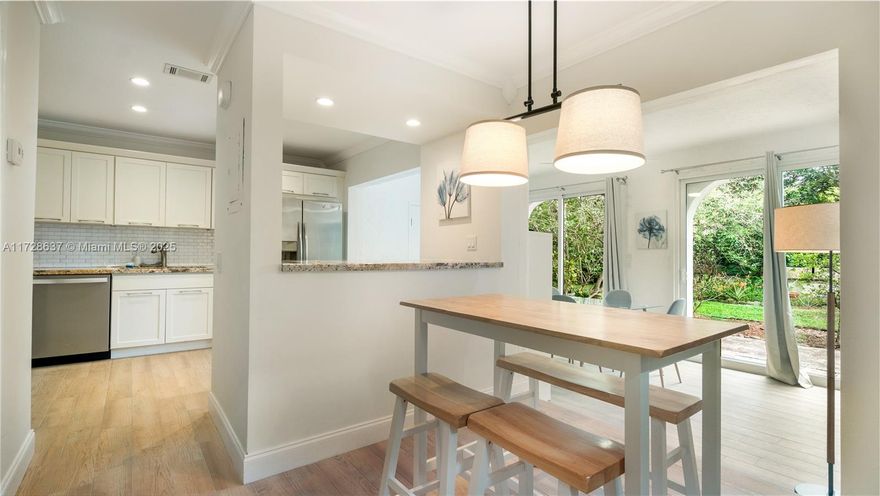 MAJOR PRICE DROP! Stunning, Fully Furnished 3BR / 2.5 Bath Two-Story Corner Townhouse! Ultra Bright, Fully Renovated with Wooden Laminate Flooring in Bedrooms & Wood Ceramic Tiling in Living Areas, New Granite Counter & Kitchen, Cabinetry, Dishwasher, Fridge & Microwave. Washer/Dryer, Separate Kitchen Island. Unique Layout offers Extra Living Space with Three Areas to Eat & Lounge. Beautiful Lighting Throughout with a Large Private Dual Patio/Garden. Impact Windows/Doors. Upstairs, you will find Three Spacious Bedrooms with Full, Queen & King Beds, another Two Full Bathrooms and plenty of Closet Space. This Special Townhouse also comes with a Spacious Storage Room off the Kitchen. Amenities include a Beautiful Pool, Clubhouse, 24 Hr. Gated Security,  1 Parking Space & Guest Parking.