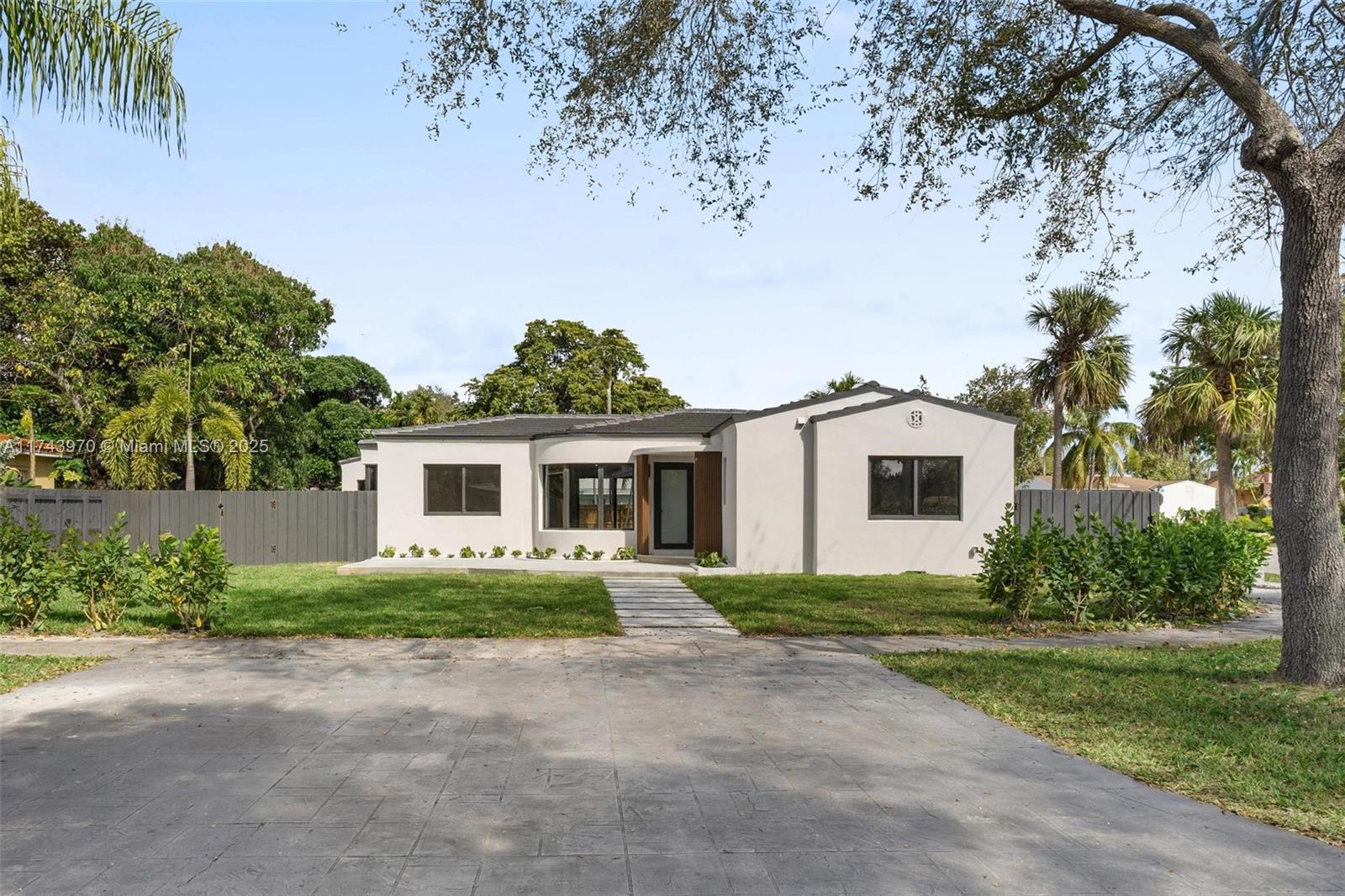 Fully Renovated Designer Home in Prestigious Miami Shores. Feat 4-bed,3.5-bath & bonus room. home on a 9,350 sq ft lot with 1,900 sq ft of living space. 4th bed W separate entrance & private bath. Features include NEW AEPTIC SYSTEM NEAR THE FENCE LINE, new electrical, plumbing, flat tile roof, impact windows/doors, waterproof white oak flooring, laundry room, split bedroom plan. The gourmet kitchen boasts quartz countertops, custom European cabinets, stainless steel appliances. Bathrooms showcase luxury tiles, custom cabinetry and quartz finishes. The master suite includes a walk-in closet and a luxurious bathroom with a double sink. The powder room opens to a lush backyard with new wood fencing and lavish landscaping. Close to schools, dining, only 15 minutes to Downtown Miami. A true gem