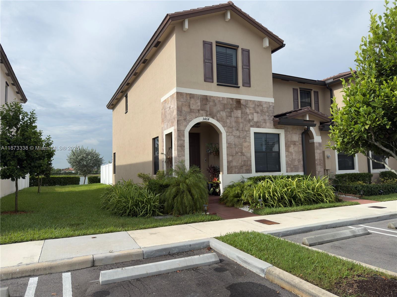 Welcome to your dream home at Aquabella! This stunning corner lot property boasts 3 beds, 2.5 baths, extraordinary features such as granite counters, SS appliances, and tile flooring throughout. For added peace of mind, the security system ensures your home is always safe and secure. Perfect layout for entertaining guests or simply enjoying a quiet night in. Step outside to your own private oasis where you can relax by its one-of-a-kind lake view. Clubhouse is the perfect spot to host gatherings, meet your friendly neighbors or visiting the gym. It offers a tranquil and upscale lifestyle, convenient access to shopping, dining, and entertainment. Don't miss out on this incredible opportunity to own a piece of paradise in one of the most sought-after communities in the area. Easy to show.