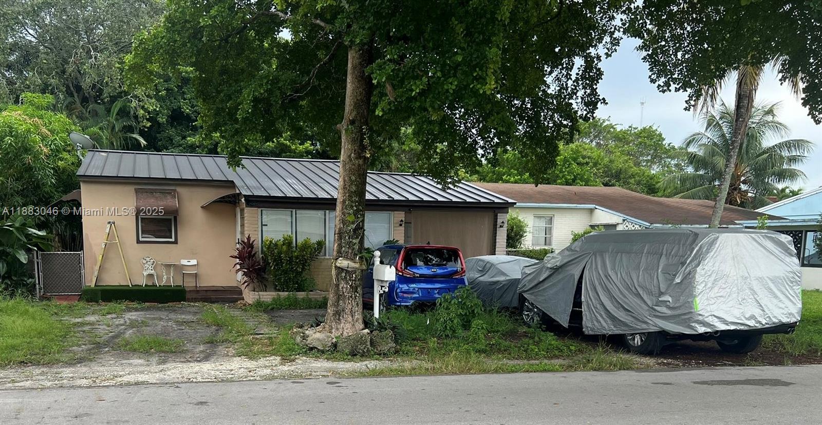 Investor/Developer Special. Excellent redevelopment opportunity in Hollywood Little Ranches! 3BR/2BA home on oversized lot with flexible layout, extra space, and carport. Property has city code violations from prior attachments/renovations—sold As-Is, ideal for experienced investors or developers. This zoning allows for construction of up to Four units, offering strong value-add potential. Prime location across from a Jewish kindergarten and minutes to downtown Hollywood, beaches, I-95, and airport.