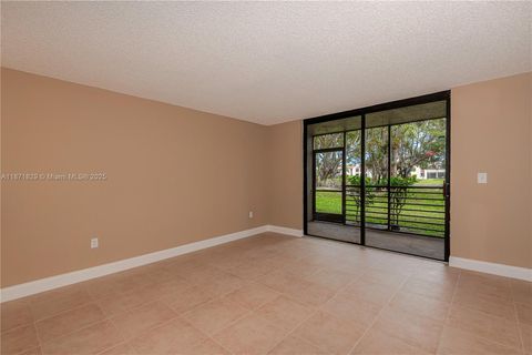 Photo of 901 Colony Point Cir #102, Pembroke Pines, FL 33026 (MLS # A11871829)