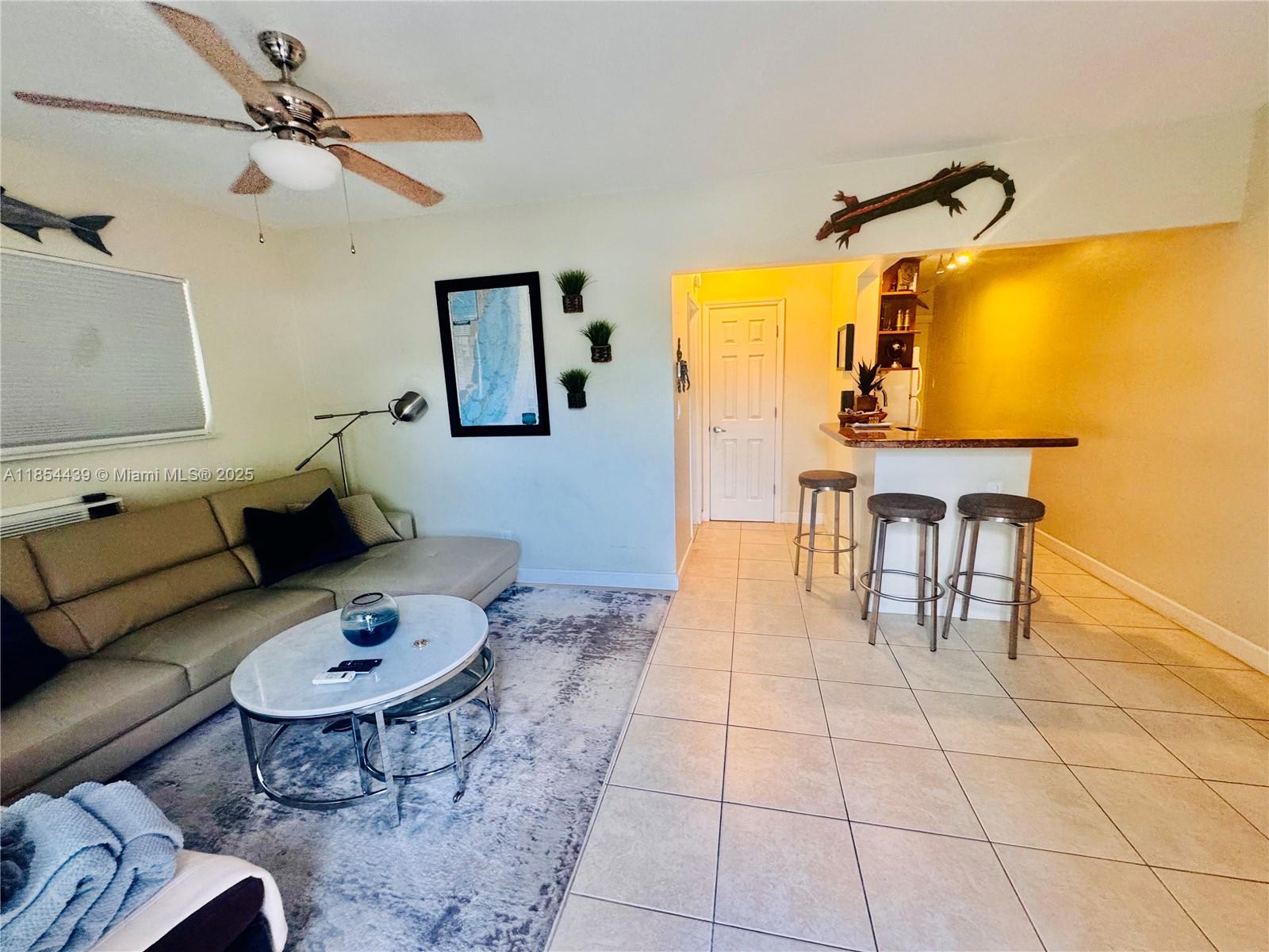 Presenting a rare gem that truly has it all, & is ideally located just minutes from Wilton Drive, downtown Fort Lauderdale, & the beach! This residence has consistent tile flooring throughout, an earth-toned kitchen with granite countertops, an updated bathroom, a spacious closet, & an in-unit washer & dryer for added convenience. Enjoy peace of mind with hurricane impact windows & doors, & the extra feature of a very large fully enclosed private backyard with a covered patio. Perfect for relaxing, entertaining or watching your dog play in the yard. The property also offers ample parking, including space for multiple vehicles, work van, large trucks, or even a small boat. Pet-friendly with fast approval, large dogs welcome! Move in day might be flexible.