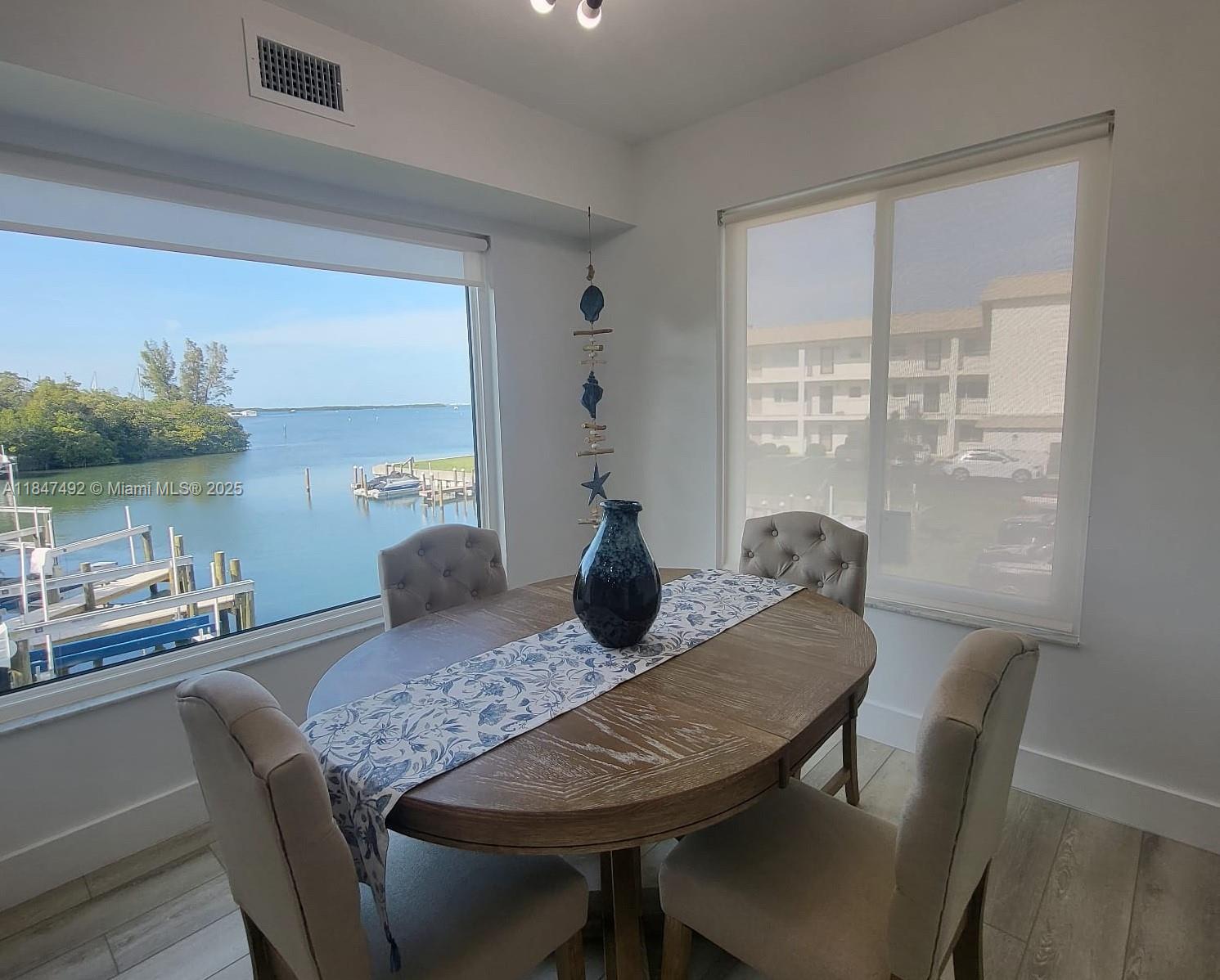 This fully renovated apartment is a sunlit, open-concept retreat with nearly every detail refreshed in 2024. The kitchen boasts custom cabinetry, quartz countertops, and a Frigidaire Gallery appliances. The second room with two beds is perfect for guests. Flooring in light wood runs throughout, and hurricane-impact floor and windows offer peace of mind. The community offers 800 feet of bayfront, heated pool, tennis courts, fully furnished.