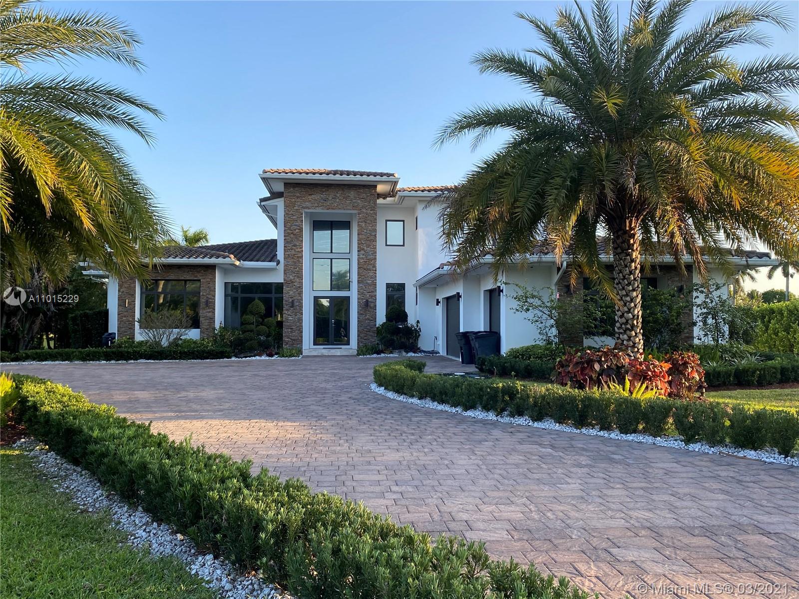 This contemporary masterpiece is an entertainer's dream and sits on 2.5 private acres. This estate boasts 24 ft soaring ceilings, Italian marble floors, designer crystal chandeliers in every room, state of the art smart home upgrades, wine cellar that holds 220 bottles, massive theatre w/starlight ceiling. The gourmet chef's kit has Wolfe appliances, dble oven, Subzero refrigerator, white quartz cntr top & center island. 42" soft close cabinets, walk in pantry. 4 way split bedroom floor plan w/1st floor owners suite & 2nd floor guest suite. Office, separate dining, wet bar, LED lighting. Yard features covered travertine patio , summer kitchen, salt water heated pool, custom sliding board w/ waterfall/diving board and spa. LOTS MORE!!! Don't miss this one!