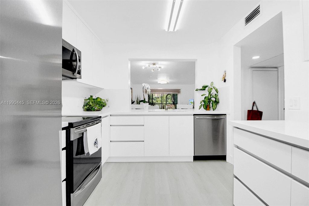 Photo of 700 SW 137th Ave #303H, Pembroke Pines, FL 33027 (MLS # A11990445)