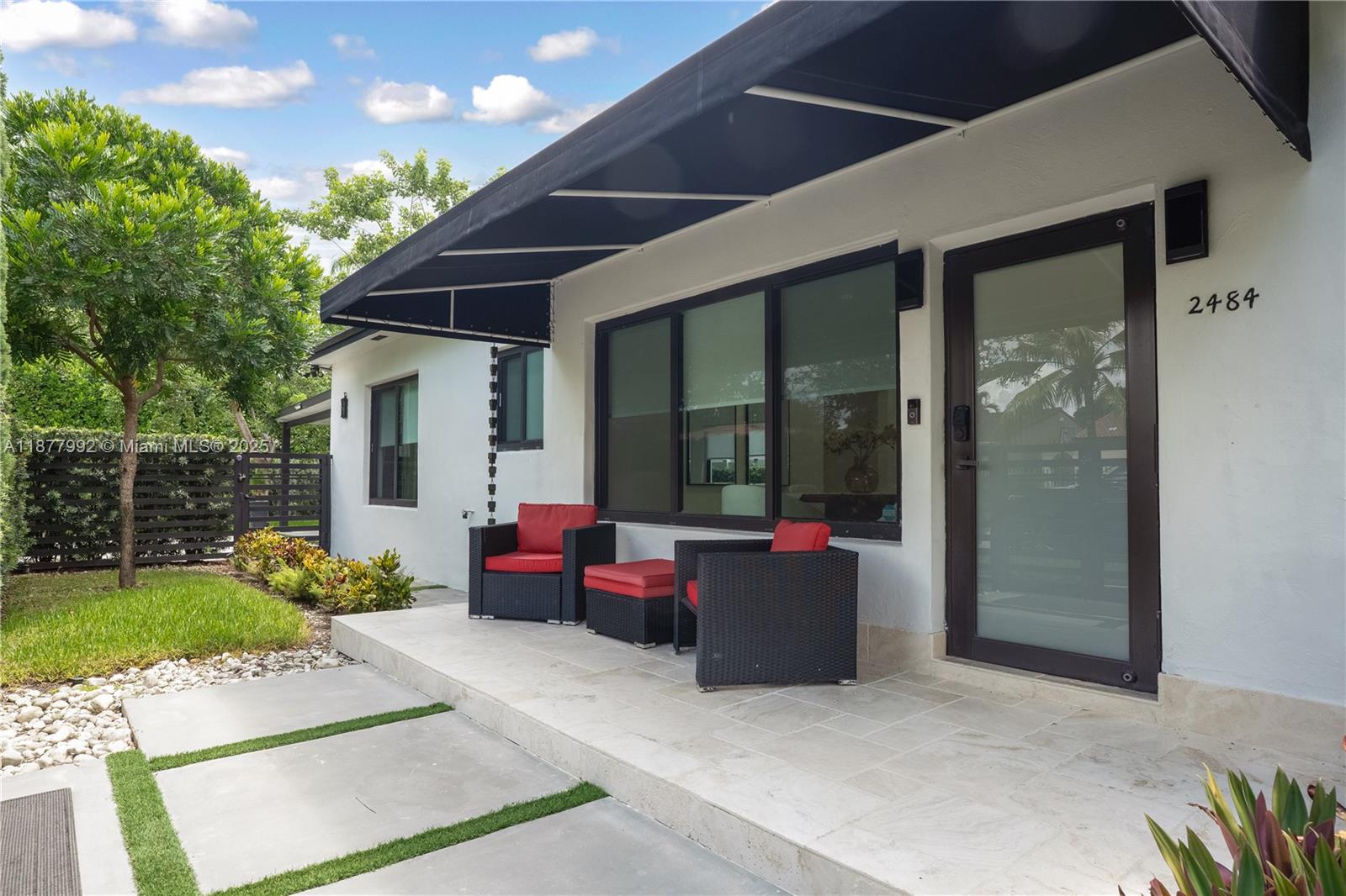 FULLY FURNISHED-Stunning fully renovated 3BR/3BA plus master den home near all vibrant areas in Miami and featuring luxury finishes throughout! Enjoy modern security with automated fingerprint/combination entry doors, Ring alarm, and full video surveillance. Spacious living room with built-in theater system, elegant tile/stone finishes, and Toto washlets bathrooms with showers & jacuzzi tub. Master suite with den opens to a private yard with a luxurious pergola. Outdoor highlights include a large carport, expansive side yard, 2 oversized storage areas, and gorgeous landscaping. Truly Move-in ready with every detail designed for comfort, style, and security!-short-term only. Minimum 3 months to a maximum of 6 months. Utilities and yard maintenance included on short term rental.