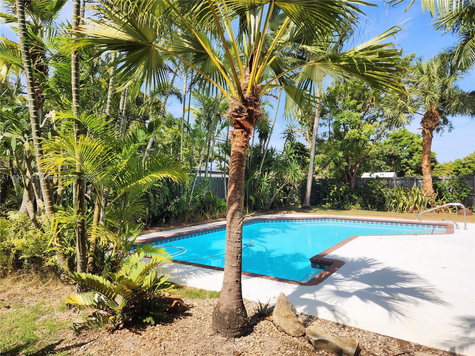 Discover your private tropical oasis in the trendy Flamingo Park Neighborhood! This midcentury charmer offers the best of South Florida living in a friendly, safe community close to I-95/595, minutes from the beach, Las Olas, airport, dining, shopping, and boat ramp. Enjoy an expansive, privacy fenced backyard perfect for entertaining—featuring a large heated pool, tropical trees, covered BBQ area, and bar. Room for RV and no HOA. Comes w/ GARAGE, impact doors/windows, and FULL HOME GENERATOR. Your dream lifestyle starts here!