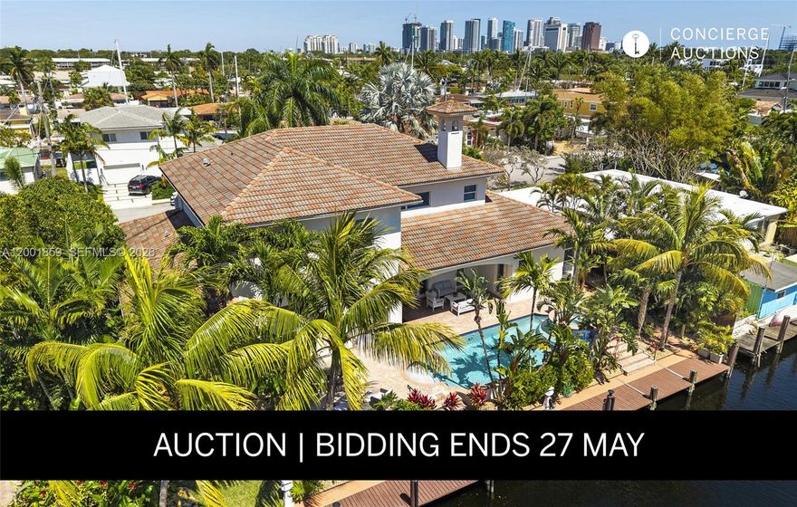 AUCTION BIDDING OPEN: Bidding ends May 27th. Previously Listed $3.5M. Current High Bid $1.95M. Showings Sunday 1-4pm, and Daily By Appt.
A boater's paradise awaits on Fort Lauderdale's prestigious Bluefish Canal, where this custom-built waterfront estate commands 100 feet of prime double-lot frontage with ocean access and no fixed bridges. Built in 2007 on the widest and deepest canal in Citrus Isles, this sophisticated estate offers over 5,200 total square feet of climate-controlled space, including 4,600 square feet of interior living area and an additional 600-square-foot air-conditioned garage.  The thoughtfully designed interior features five bedroom suites—each with full en-suite bathroom and walk-in closet. Lavish marble flooring flows throughout spaces adorned with Venetian plaster, while the gourmet kitchen showcases high-end appliances. Smart home technology provides effortless modern convenience. The full 100-foot dock with 30/50 amp service accommodates substantial yachts, while the south-facing orientation and hurricane-protected location ensure year-round enjoyment. Minutes to Fort Lauderdale International Airport, Las Olas Boulevard, and pristine beaches, this estate delivers an unparalleled waterfront experience.