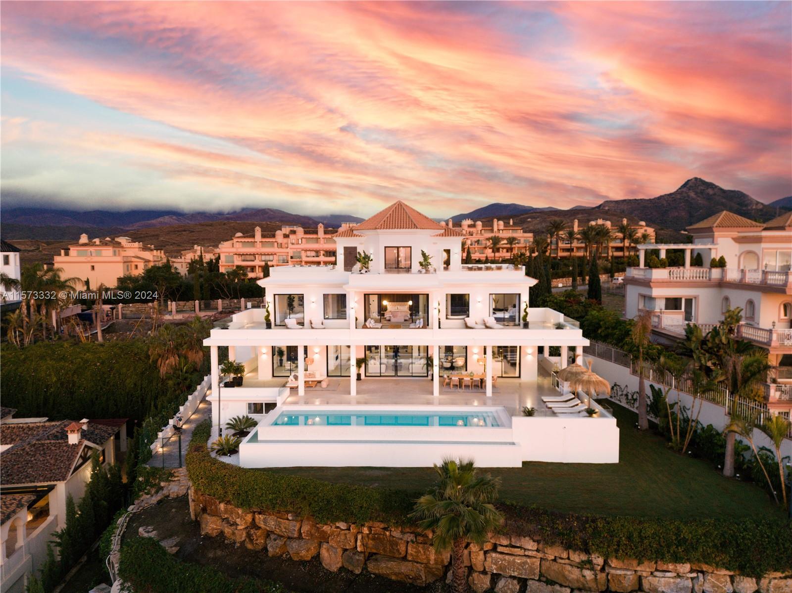 Property is located in Benahavis, Spain. Villa Dreamscape: This villa in Los Flamingos, Benahavis offers 6 bedrooms and 6 bathrooms. Built in 2009 and renovated in 2023, it features a modern Scandinavian design with premium materials and Gaggenau appliances. Amenities include an office, 3 pools, cinema, spa, gym, and a south-facing view of the sea and mountains. The gated community ensures safety and includes a 5-star hotel, golf courses, and a spa. Shops, schools, and beaches are within a 10-minute drive. The property has a 3-car garage, 7-car driveway, and 24/7 security, plus a heated pool, landscaped garden, and solar panel provision.