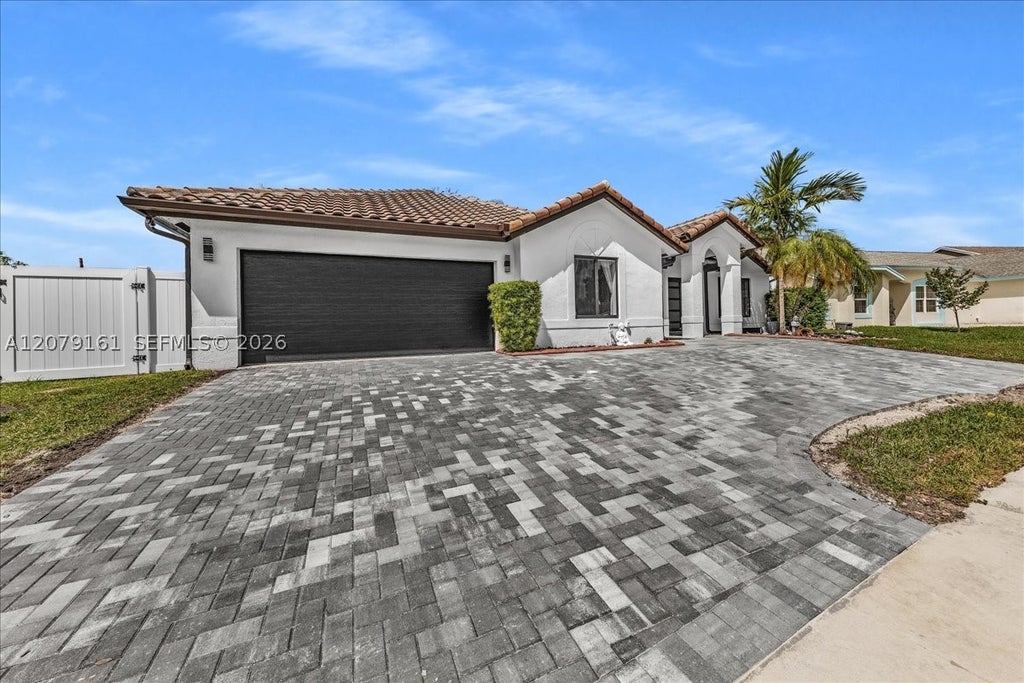 Photo of 15056 SW 10th St, Sunrise, FL 33326 (MLS # A12079161)