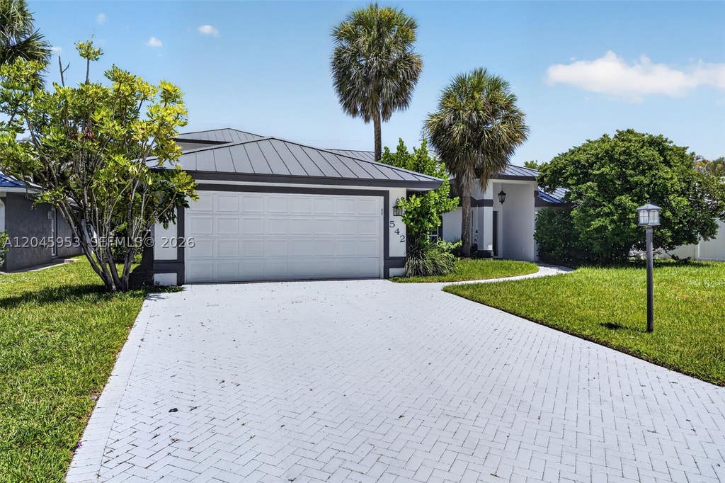 Photo of 542 N Cypress Dr #542, Tequesta, FL 33469 (MLS # A12045953)