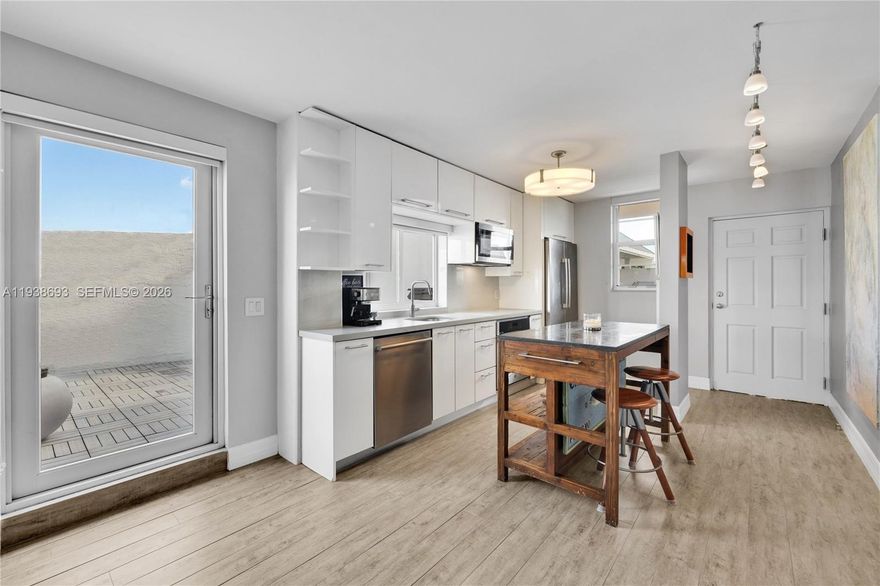 Live large in this gorgeously updated, two bedroom, two ensuite bath, Nirvana Condo Penthouse corner residence! Enjoy an oversized open-flow plan with ~1,100 SF of interiors, including updated chef-ready gourmet island kitchen, large dining, and generous living, connected to a spacious rooftop terrace— separate, yet also shared with an adjacent 2/2 unit (APH3), perfect for private or communal entertaining and relaxing, enveloped by majestic banyan trees and tropical gardens. Fantastic amenities: impact windows-doors, wood-plank tile floors, in-unit laundry, full-time guard-gated, controlled access, state-of-the-art fitness, and deli and convenience store, two pools, jacuzzi, sauna, bayfront beach, and kayak-paddleboard storage. Your all-inclusive tropical oasis penthouse by the bay awaits!