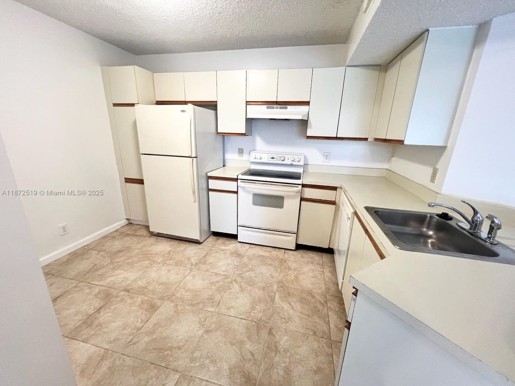 Photo of 8977 Wiles Rd #205, Coral Springs, FL 33067 (MLS # A11872519)