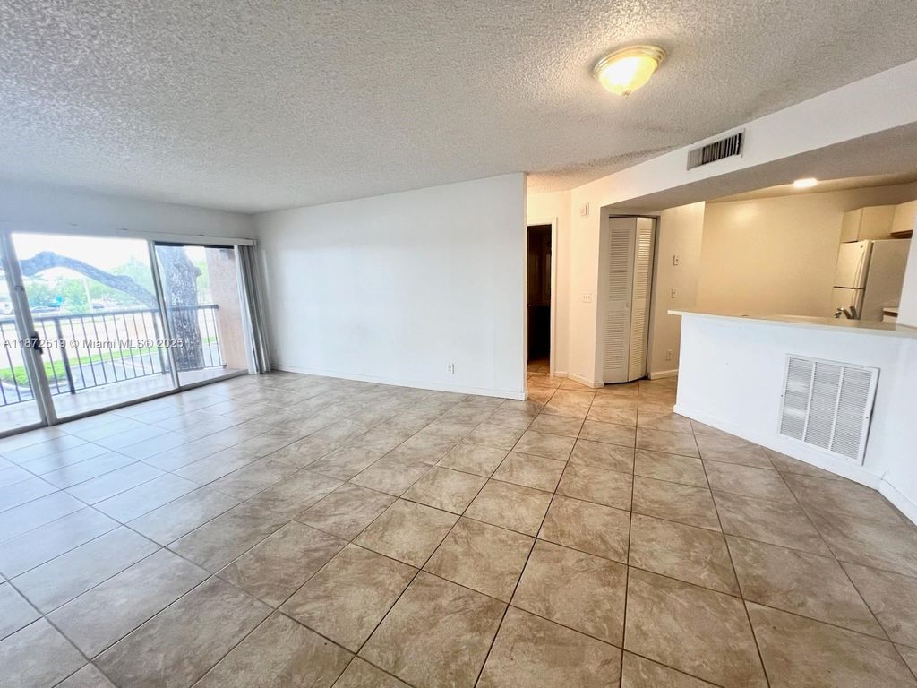 Photo of 8977 Wiles Rd #205, Coral Springs, FL 33067 (MLS # A11872519)
