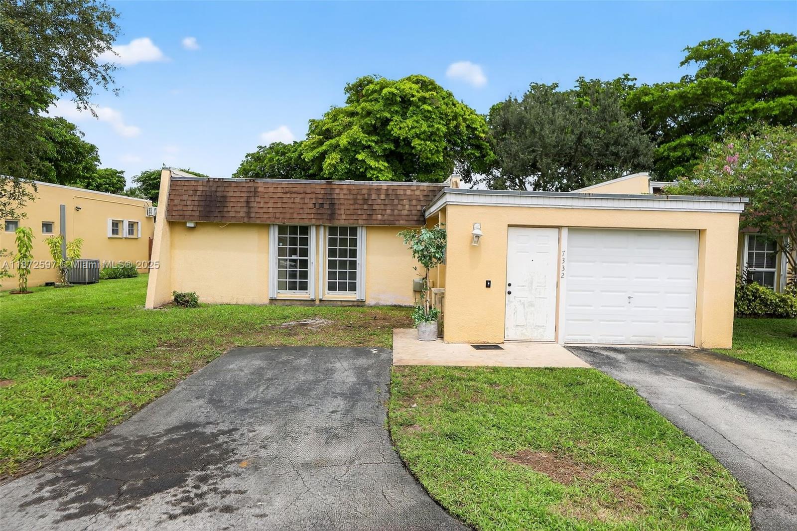 Tucked away in the renowned Country Club of Miami, step inside this large 2/2 villa/townhome with grand open layout, one car garage, and private patio. Home has impact windows along with hurricane shutters. Home is conveniently located near shops/restaurants with easy access to tennis courts and golf course. Great property to add your finishing touches as home is in need of interior TLC and being sold as-is. Roof is older with active leak and will need to be replaced. Cash offers only.