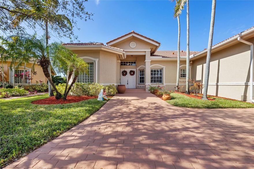**NEW LOWER PRICE**Welcome home to your  beautiful well kept 5 bedroom and 3 bath home built in 2005 in a private gated community of Plantation Lago.  easy access to 595/75 and all shopping including popular Sawgrass Mills mall, its shops, restaurants and the Sunrise Arena. This home has a perfect layout with 12 foot ceilings,  a  split floorplan with granite countertop kitchen that offers a bright airy feeling that's  welcoming and open to the family room that's perfect for entertaining. The master bedroom has his and hers dual walk in closets. a large enough yard with room to install your own private pool. enjoy your neighborhood walk or golf cart to Lago Mar CC. This home is the perfect location to commute to Ft Lauderdale or Miami airports. Please note: total Sq footage is 3,489 sq ft