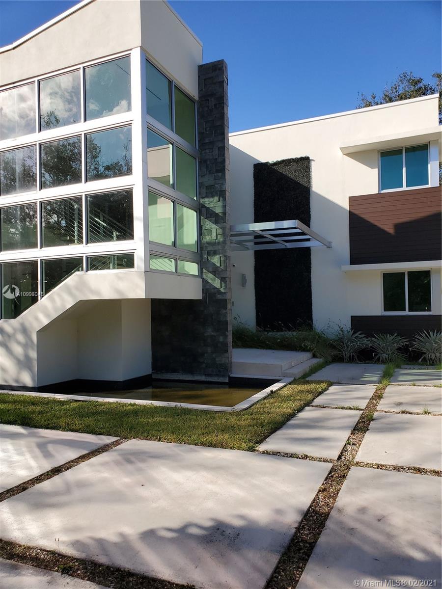 Moderism comes to Pinecrest in this 2 story amazing masterpiece designed by architect Ralph Puig. If you are looking for a smart home with all the high end technology people want in todays market, you must put this home on your list to see. Wonderful floor plan with all your entertainment, office space and living downstairs and your 7 bedrooms upstairs. Every Chef’s dream is the gourmet kitchen designed by Dada, including multiple ovens, Wolf gas stove, and refrigerator for your Crystal champagne. Elevator for those who have trouble on the stairs. Car buffs you have a 3 car garage with enough height to install a lift for your toys. Lounge outside in your salt water pool and jacuzzi and enjoy the serenity of your home. All Measurements are estimated. Buyers must due their own due diligence.