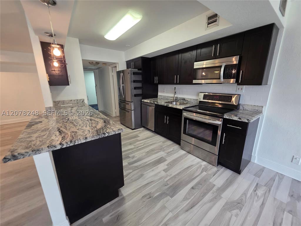 Photo of 701 Three Islands Blvd #110, Hallandale Beach, FL 33009 (MLS # A12078248)