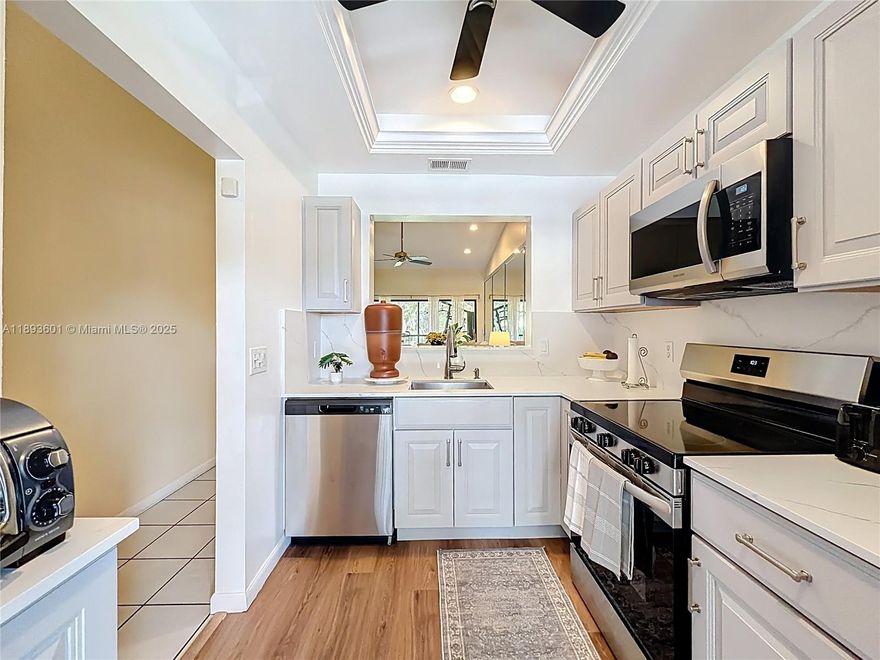 Welcome to Meadowridge, an all-ages condominium with a beautiful clubhouse with library, exercise room and pool. Newer roof, 40 yrs inspection done and wind mitigation passed. Enjoy the peaceful location of this unit, off the main road. New open kitchen to living area, SS appliances, tiled throughout and a split plan design with a large master suite with ample closet space. The west exposure of the screened porch offers a peaceful garden view with no rear neighbors. A separate storage also provides extra room. Close to shopping, restaurants and easy access to major roads. No pets, unless support pets, credit score 675+ for Condo approval. No rentals allowed 1st year with a 4 months rental min/yr