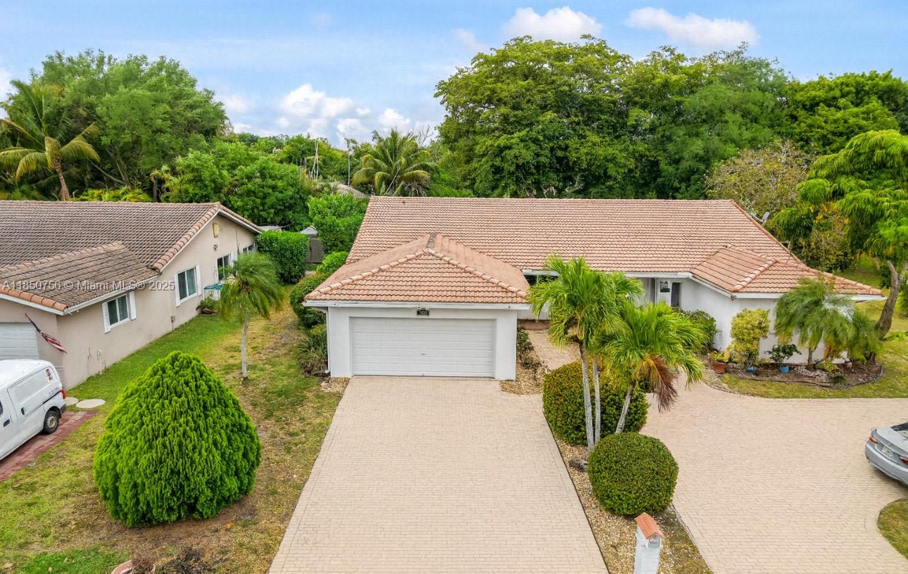 Lakefront Villa in Prime Coral Springs / NO HOA. Updated 2 bedroom, 2 bathroom villa home offers over 1,300 sq. ft. of living space with tranquil lake views and lush landscaping for privacy. Enjoy a private entry, spacious screened in porch, and a rare 2-car garage with oversized driveway and separate entrance. Inside features include an upgraded kitchen with granite counters, updated bathrooms and floors, stainless steel appliances, and a separate laundry room.
Nestled on nearly 6,000 sq. ft. of land that flows directly to the water perfect for relaxing or entertaining.
All this an a prime location just minutes from Costco, Sawgrass Expressway, top-rated schools, shopping, and dining. A rare find in Coral Springs.