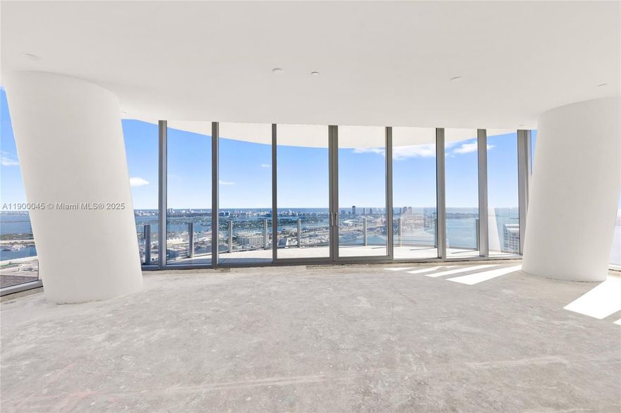 Experience breathtaking sunrises and sunsets from every room in this remarkable penthouse, the crown of the 01 line, offering 360° views of the Miami skyline, Biscayne Bay, and the ocean. With soaring ceilings and wrap-around terraces, the residence captures natural light and promotes effortless indoor-outdoor living. Delivered designer-ready, it offers flexibility with an alternate floor plan for personalized finishes. A gallery-style entry hall welcomes you into the home, ideal for displaying art, while two private elevators open into a secluded vestibule. The sleek Bulthaup kitchen, featuring pristine white cabinetry, anchors the residence in a refined, modern aesthetic that embodies Miami luxury.