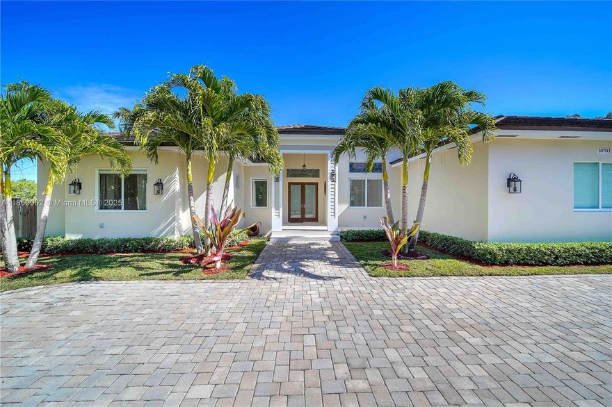 Built in 2019 by a contractor. This beautiful 4,500+ SQFT, 4-BD, 5-BA home sits on a sizable 18k+ SF lot. The residence showcases beautiful curb appeal on quiet block. Walk into 13 foot ceilings with custom oversize 8 ft doors. An eat-in kitchen offering marble & granite countertops, stainless-steel appliances, built-in island/table doubles as seating, & walk-in pantry for extra storage. The open layout seamlessly connects the kitchen, & family rooms with sliding doors to the patio, merging indoor and outdoor entertainment areas. Enjoy your backyard all year round, covered patio, & plenty of room to entertain guests. Additional features include an irrigation with well water, Generator, impact, 2-car garage, pre-wired for security cameras & surround sound.