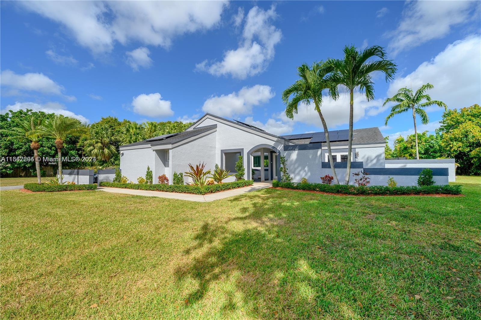 This beautifully remodeled 4-bedroom, 2-bathroom pool home offers an expansive open layout perfect for modern living and entertaining. This property combines luxury, comfort, and convenience in a tranquil setting. Enjoy the spacious, light-filled living area with high ceilings and large hurricane impact windows and doors that create a seamless flow between the indoor and outdoor spaces. The luxurious master bedroom boasts a generous walk-in closet and a spa-like en-suite bathroom complete with a tub, walk-in shower, and dual vanities. Step outside to your private backyard retreat, where you'll find a sparkling pool, spacious deck, and plenty of room for outdoor dining and relaxation.This home offers both privacy and accessibility. This home combines elegance with functionality.