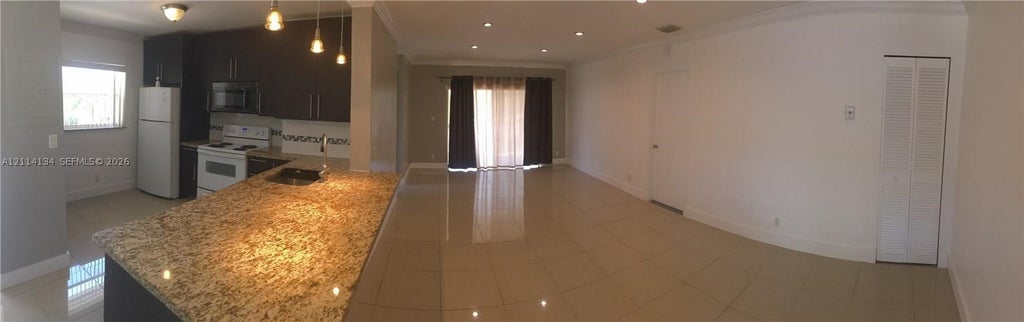 Photo of 12143 Royal Palm Blvd #8E, Coral Springs, FL 33065 (MLS # A12114134)