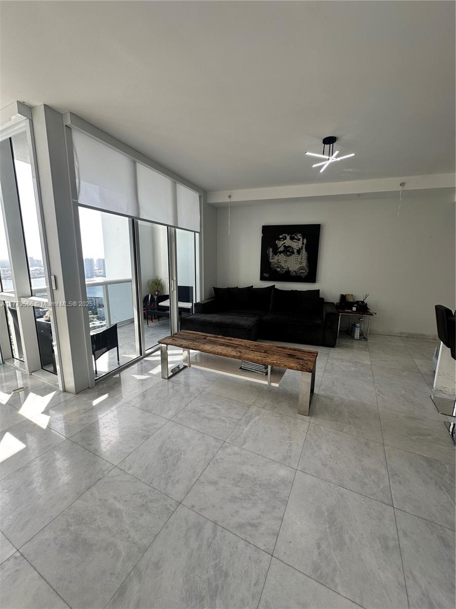 Stunning 2/2 with Intercostal and Partial Ocean Views! This residences features floor-to-ceiling windows, marble floors, quartz countertops in the kitchen, custom closets, electric shades, and a new washer/dryer. The oversized primary suite includes a walk-in closet and dual-vanity bath with mosaic tile and his and hers bathrooms. Enjoy views of the Intracoastal, downtown skyline, and partial ocean from the balcony. Can be rented with or without furniture. Trump Royale offers 5 stars amenities including Tennis courts, Basketball Fields, Fitness Center, Full Service Beach and Pool, and much more!